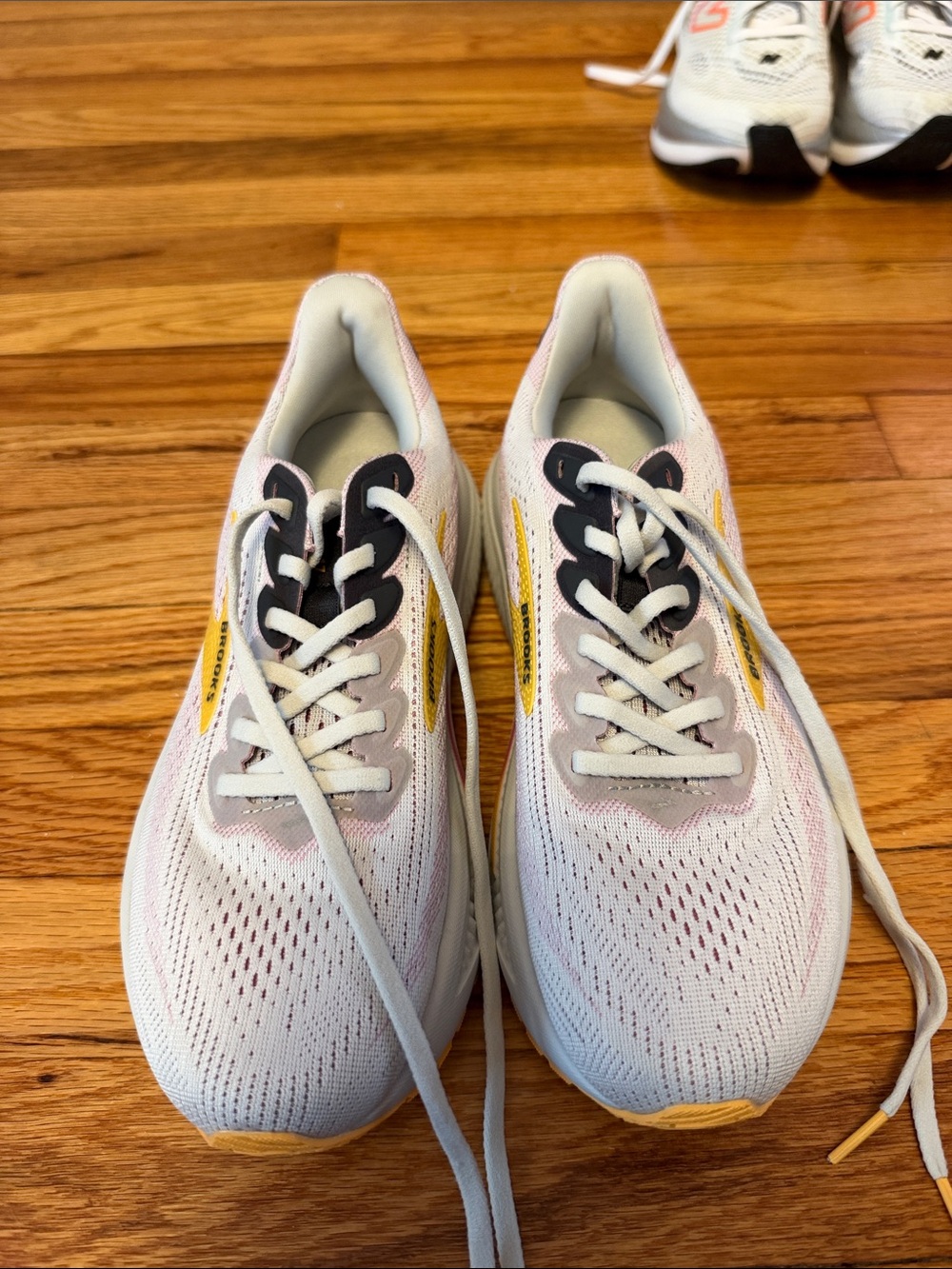 Brooks Women's White Sneakers with Yellow and Black Accents